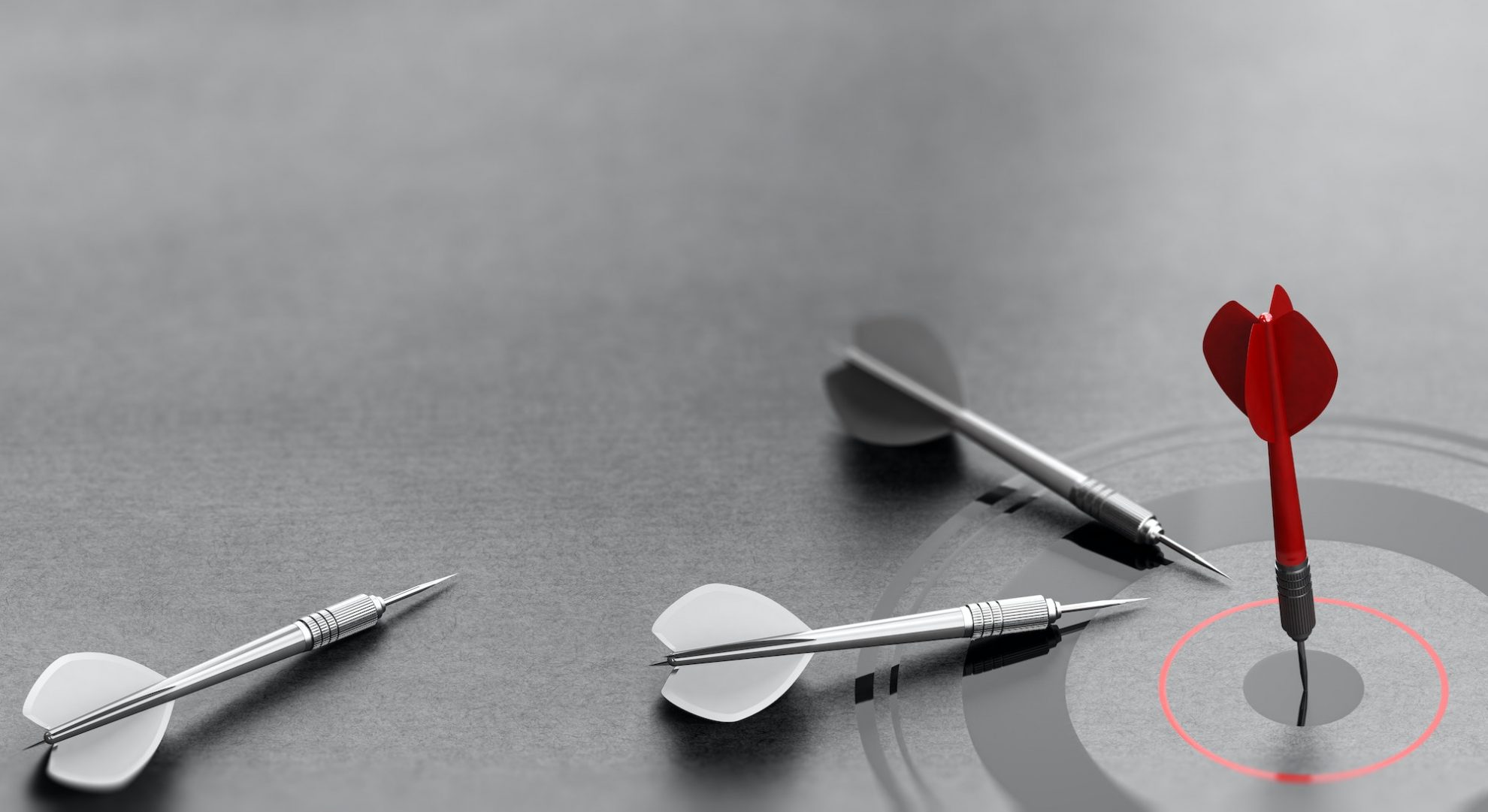 successful business concept red dart reaching center of a target