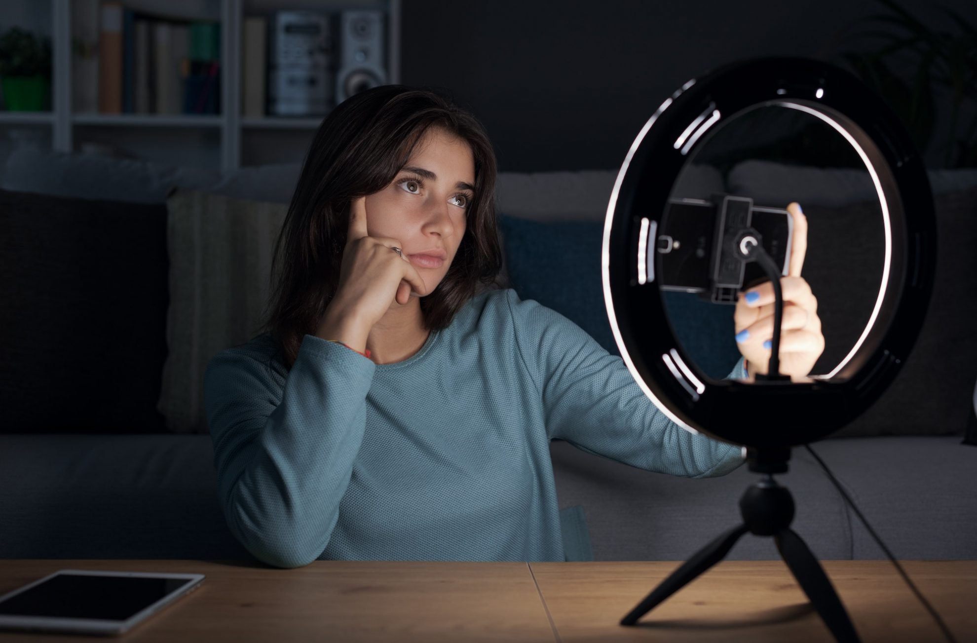tiktoker recording videos with her smartphone